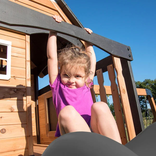 Casavibeo Canyon Creek Swing Set with colorful swings and climbing frame, outdoor children’s play equipment on green grass.
