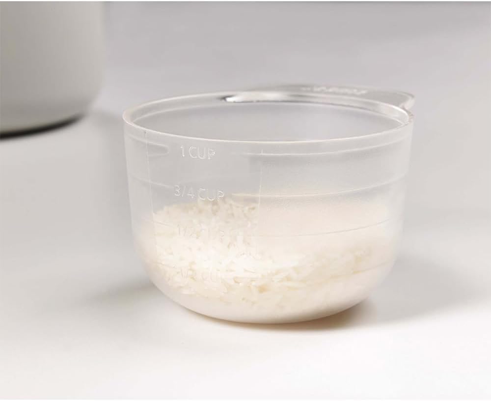 Belro microwave rice cooker steamer on kitchen countertop, showing white plastic container with lid for easy rice steaming.