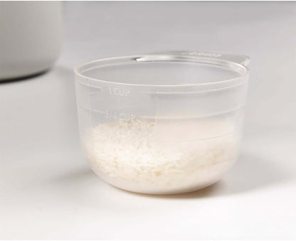 Belro microwave rice cooker steamer on kitchen countertop, showing white plastic container with lid for easy rice steaming.