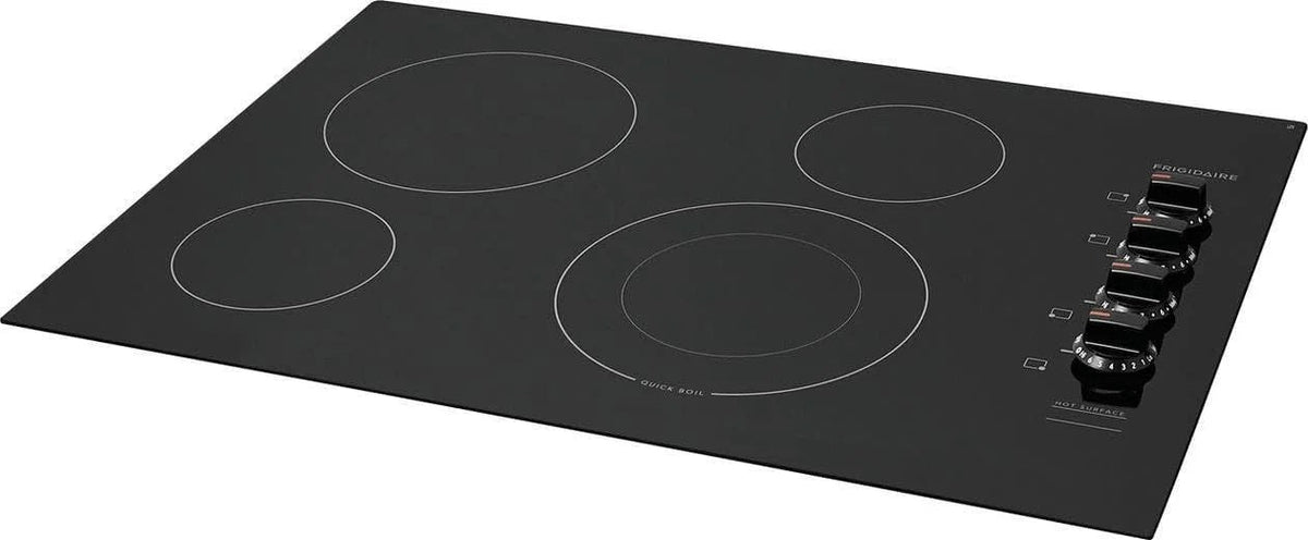 Casavibeo Frigidaire electric cooktop with four burners and sleek black surface, digital controls, and modern design.