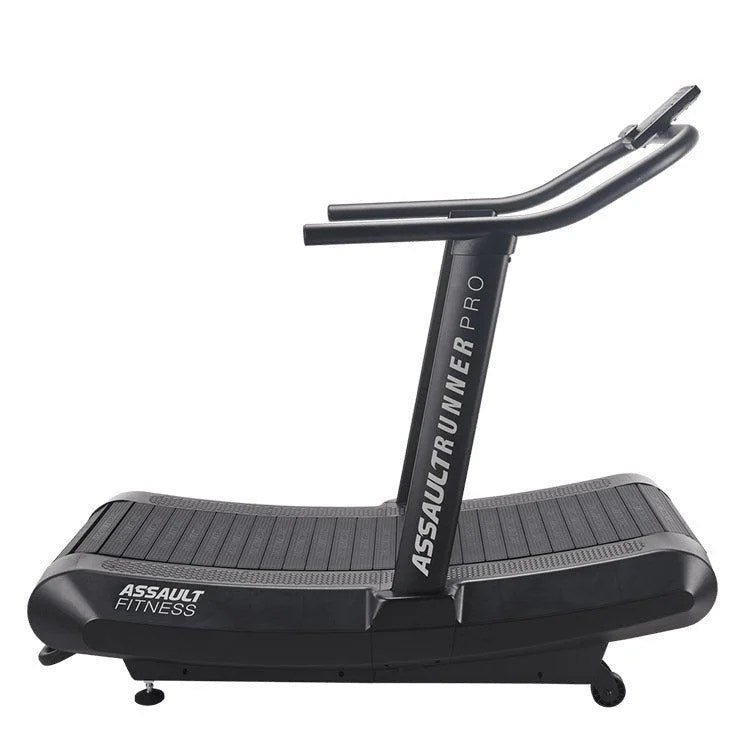 Casavibeo Assault Fitness AssaultRunner Pro treadmill with digital display and sturdy frame, shown from a side angle.