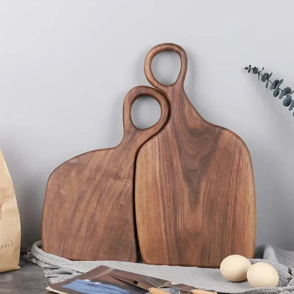 Set of two walnut wooden cutting boards from Mivoza with loop handles for hanging, ideal for kitchen prep and presentation.