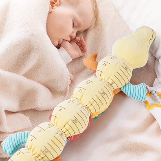 Soft plush sensory caterpillar baby rattle with musical features, designed for infants, by Belro.