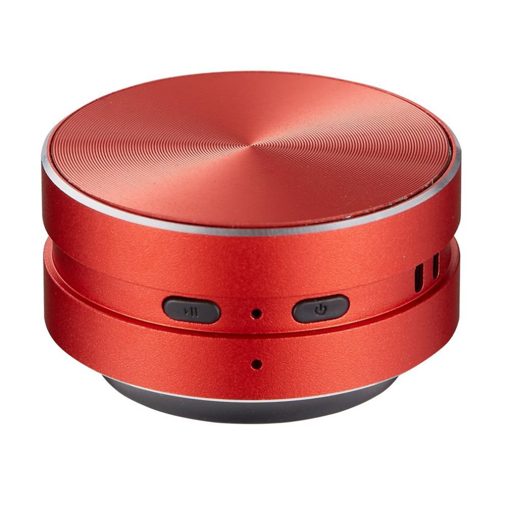 Belro Bone Induction Speaker attached to a surface, showcasing portable electronic audio device that turns surfaces into speakers.