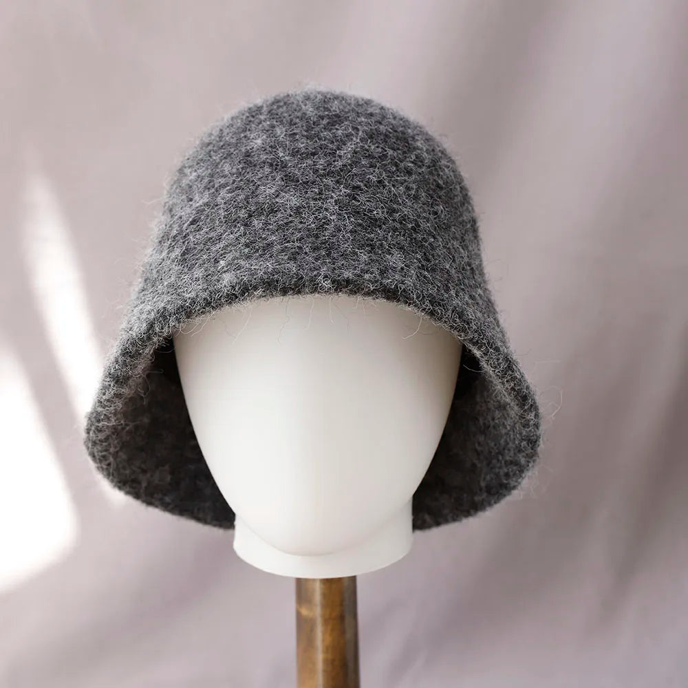Women's winter wool bucket hat by Belro featuring a cozy, textured design in neutral tones, perfect for cold weather accessories.