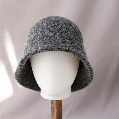 Women's winter wool bucket hat by Belro featuring a cozy, textured design in neutral tones, perfect for cold weather accessories.