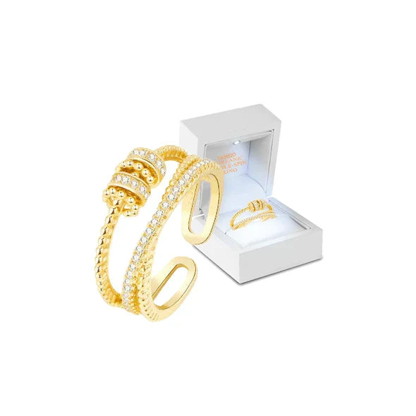 Belro Threanic Triple-Spin Ring showcasing three interconnected silver-tone rings with intricate design details.