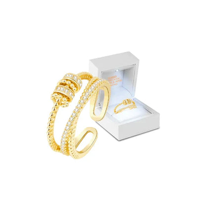 Belro Threanic Triple-Spin Ring showcasing three interconnected silver-tone rings with intricate design details.