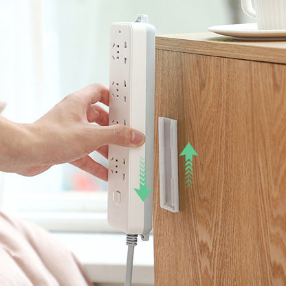 Belro adhesive punch-free socket holder attached to a wall for convenient clothing or accessory storage in a men's space.