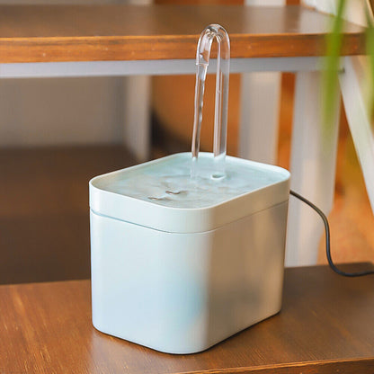Belro pet water dispenser for dogs, featuring a transparent water bowl and convenient drinking system in a pet supplies setting.