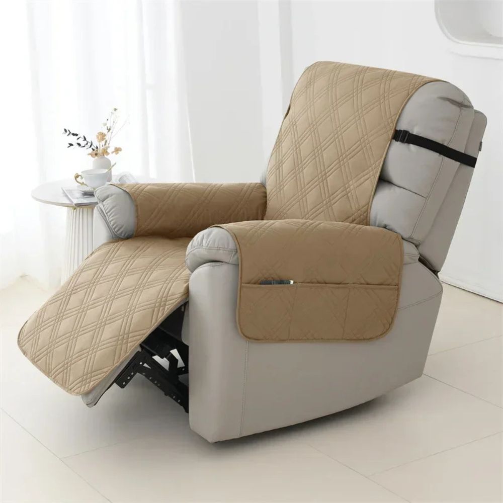 Belro waterproof quilted recliner arm chair slip cover on a sofa, showing its padded quilted design and snug fit for protection.