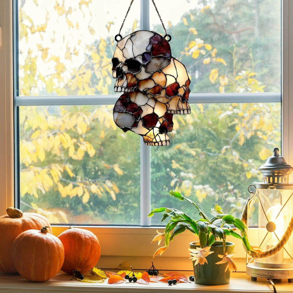 Belro hanging skeleton head decoration for Halloween, featuring a realistic skull with hollow eye sockets and a spooky design.