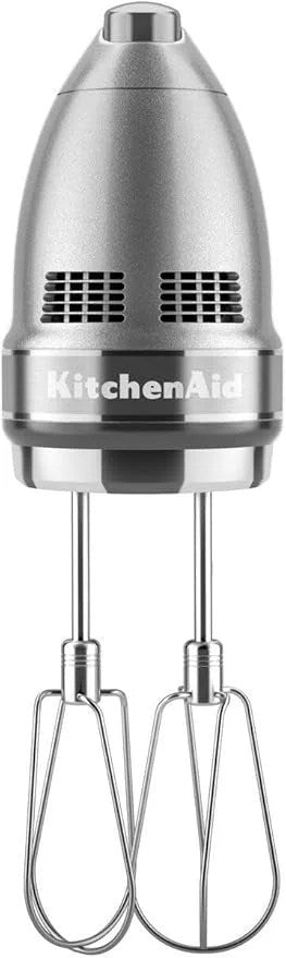 KitchenAid 9-speed digital hand mixer with turbo beater II and pro whisk in contour silver, showing control buttons and attachments