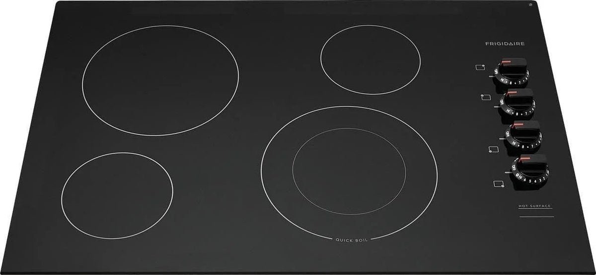 Casavibeo Frigidaire electric cooktop with four burners and sleek black glass surface, modern kitchen appliance.
