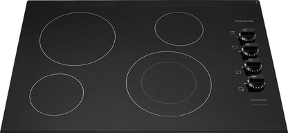 Casavibeo Frigidaire electric cooktop with four burners and sleek black glass surface, modern kitchen appliance.