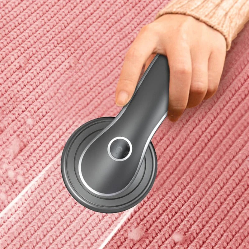 Belro lint remover for home and outdoor use, showing the handheld device with a textured cleaning surface in close-up.
