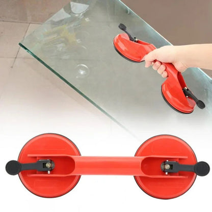 Belro dual suction glass window dent pulling suction cup attached to a glass surface for dent removal or repair.