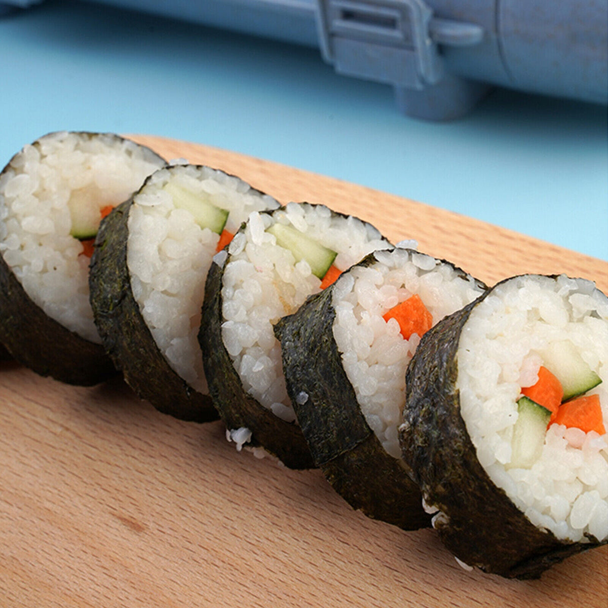 Belro Sushi Bazooka for making sushi rolls, featuring a compact kitchen tool with clear instructions for easy sushi preparation.