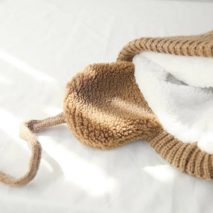 Kids knit beanie winter hat with earflaps from Belro, cozy and warm winter accessory for children, featuring colorful knit design.