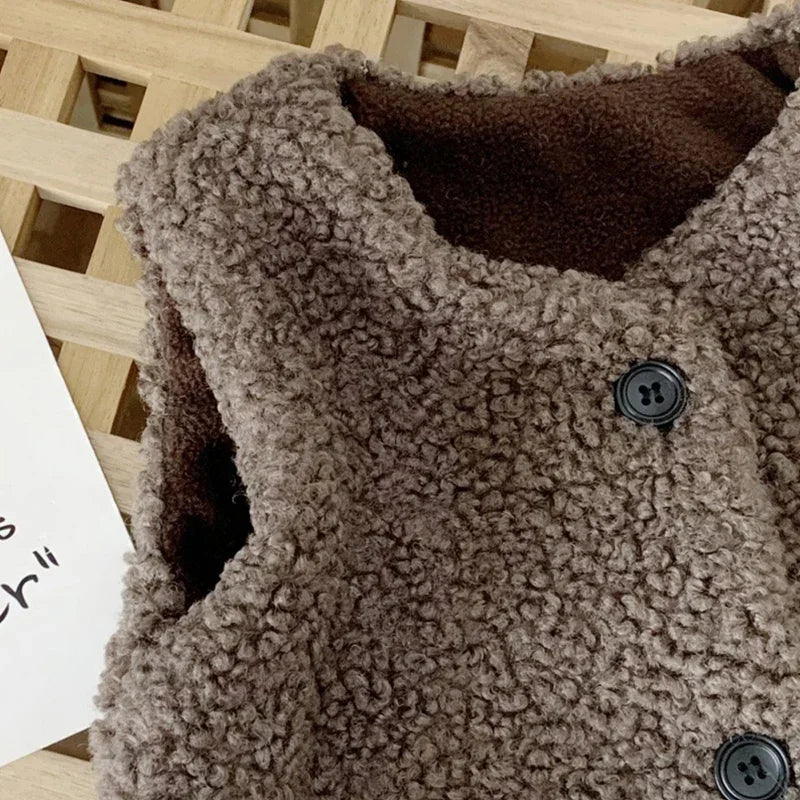Kids lamb wool winter waist coat by Belro, cozy beige jacket with button details, ideal for cold weather.