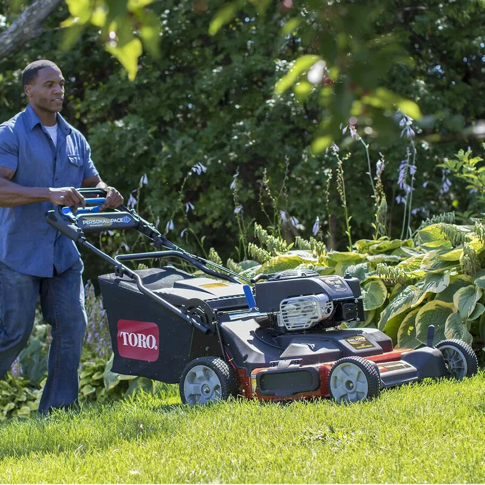 Casavibeo Toro TimeMaster 21199 30-inch gas self-propelled lawn mower with 223cc engine, shown in a yard setting.