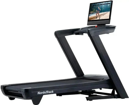 Casavibeo NordicTrack Commercial 2450 treadmill with running belt, control console, and safety handrails in a home gym setting