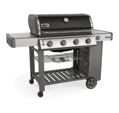 Casavibeo Weber Genesis II E-410 NG gas grill with four burners, stainless steel lid, side shelves, and control knobs visible.