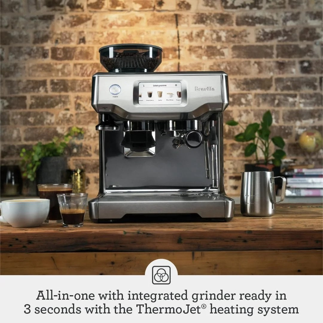 Casavibeo Breville Barista Touch espresso machine with digital display and stainless steel finish on a countertop.