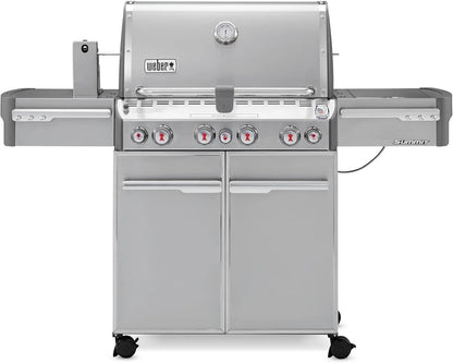 Casavibeo Weber Summit S-470 gas grill with stainless steel lid, four burners, side shelves, and control knobs for outdoor cooking