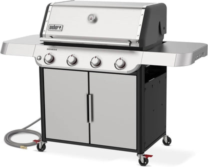Casavibeo Weber Genesis S-415 natural gas grill with four burners, stainless steel lid, side shelves, and control panel.