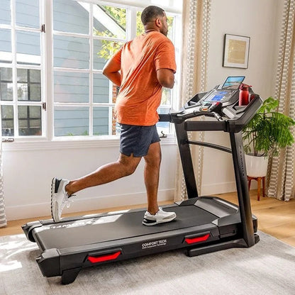 Casavibeo Bowflex BXT8J treadmill with digital console and running belt, set up in a home gym environment.