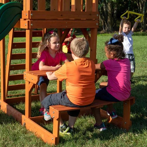 Casavibeo Backyard Discovery Tucson swing set with slide, swings, and climbing features in a backyard setting.