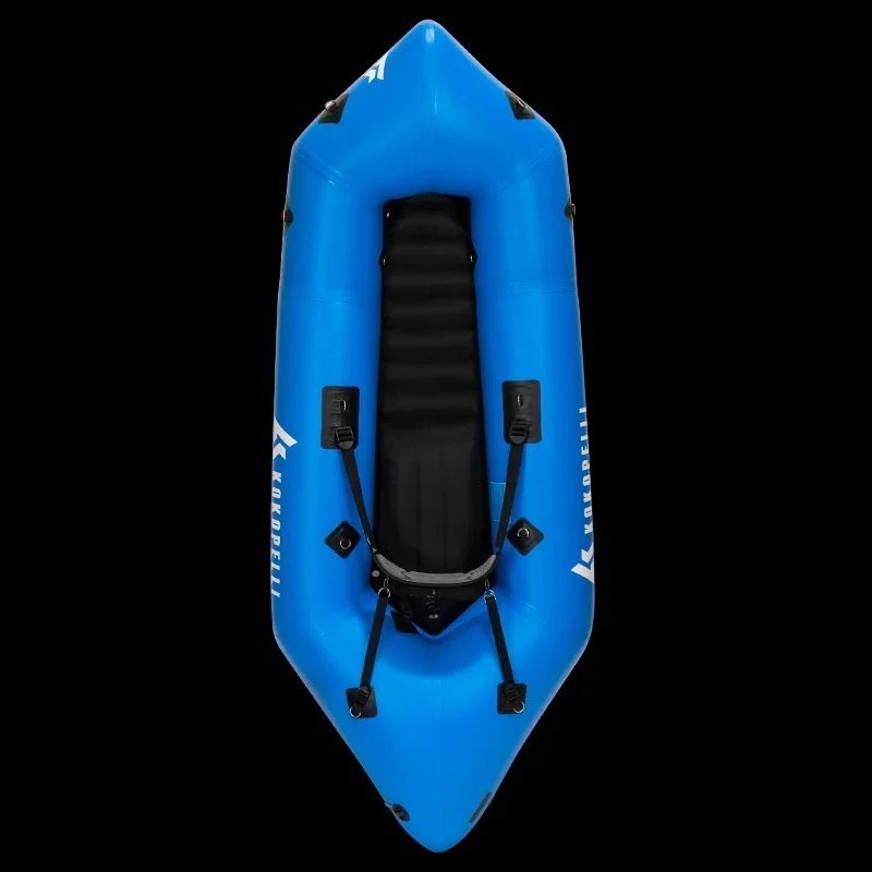 Casavibeo Recon inflatable kayak floating on water with paddles, ready for outdoor adventure.