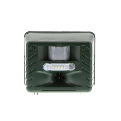Belro ultrasonic bird repeller for woodpeckers, outdoor pest control device in garden setting, designed to deter woodpecker activity.