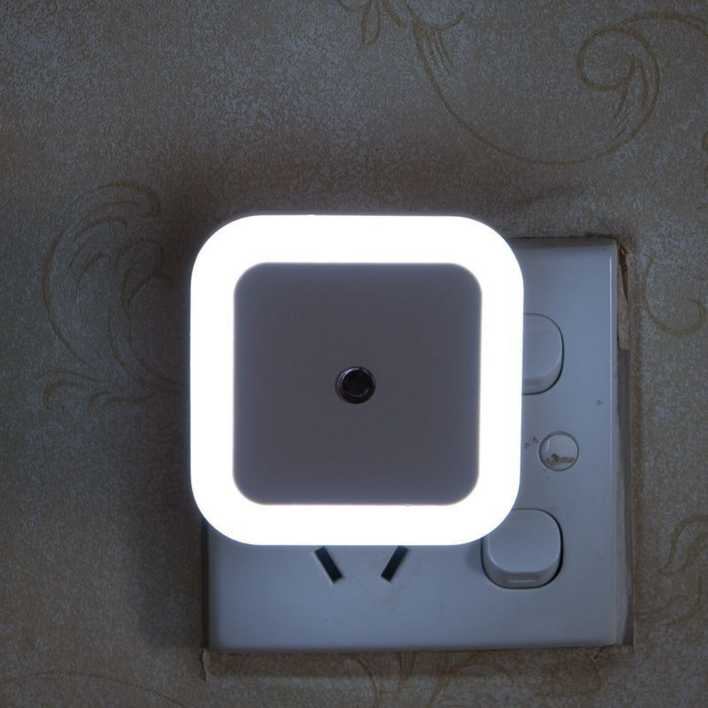 Belro plug-in motion detector smart outlet night light showing connected device in a home setting with a night glow.