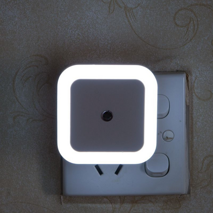 Belro plug-in motion detector smart outlet night light showing connected device in a home setting with a night glow.