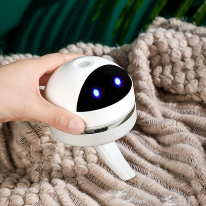 Belro compact USB charging mini desk vacuum cleaner robot on a desk, designed for electronic cleaning and charging.