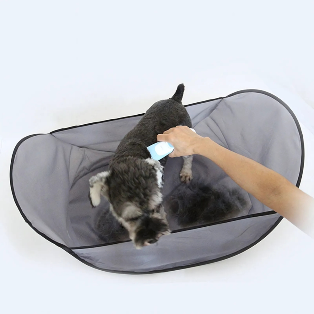 Belro waterproof pet grooming hair catcher for dogs and cats, shown in use during grooming to trap loose hair effectively
