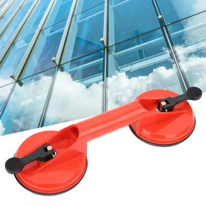 Belro dual suction glass window dent pulling suction cup attached to a window surface for dent repair.