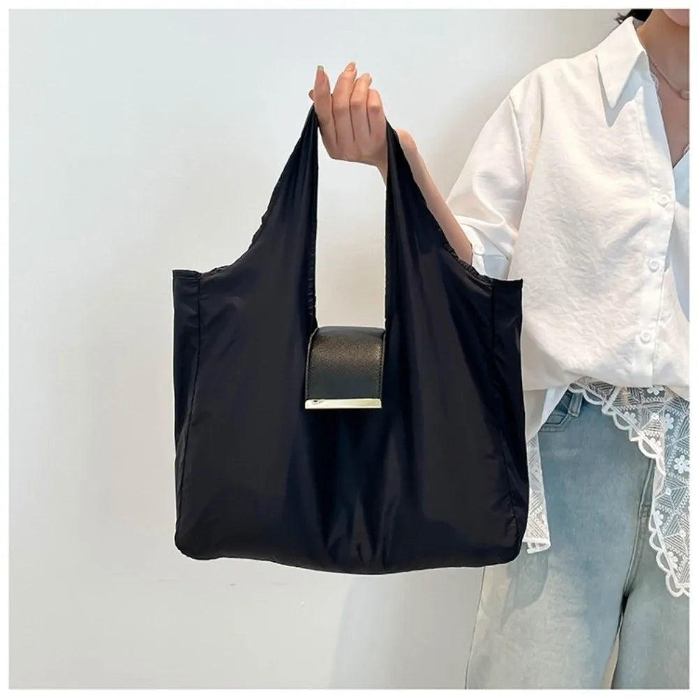 Belro mini foldable tote bag keychain accessory, compact and lightweight with a foldable design, ideal for carrying small essentials.