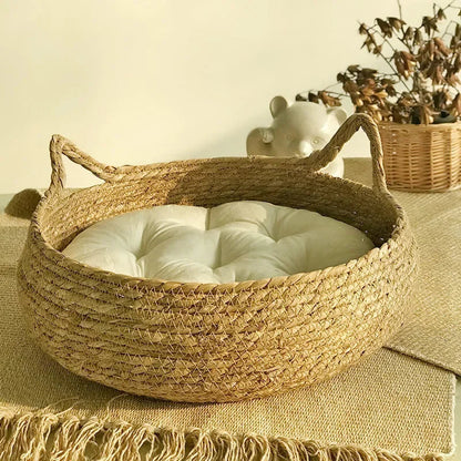 Handmade woven Belro cat bed with a seasonal padded cushion, designed for cozy comfort in home and garden furniture.