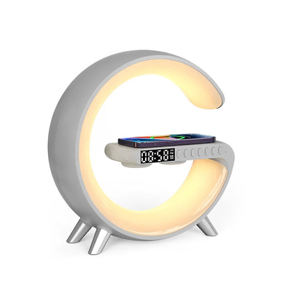 Belro digital desk clock on a home workspace, displaying time on a modern glass surface with a sleek design.