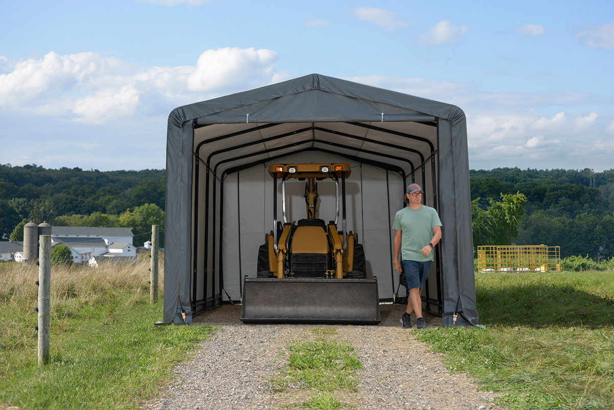 Tan Casavibeo ShelterTube garage shelter, 10x14x8 feet, wind and snow-load rated, set up outdoors on a snowy landscape.