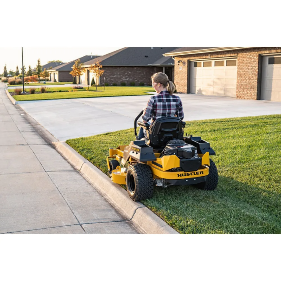 Casavibeo Hustler Raptor X zero-turn mower with 42-inch deck, Kawasaki FR600 18hp engine, shown in a yard setting