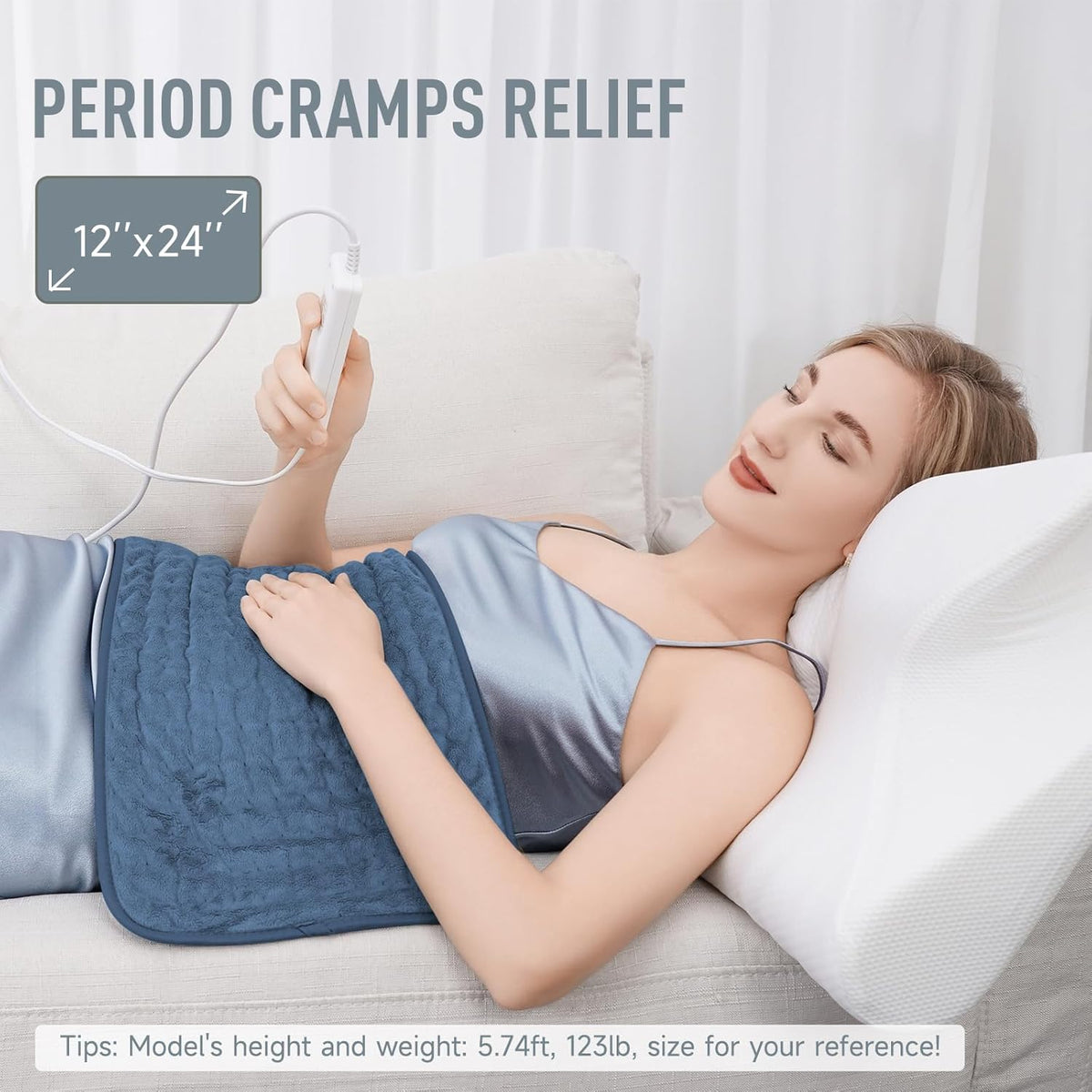 Belro electric heating pad for back pain relief, soft fabric cover, plugged in ready for soothing heat therapy.