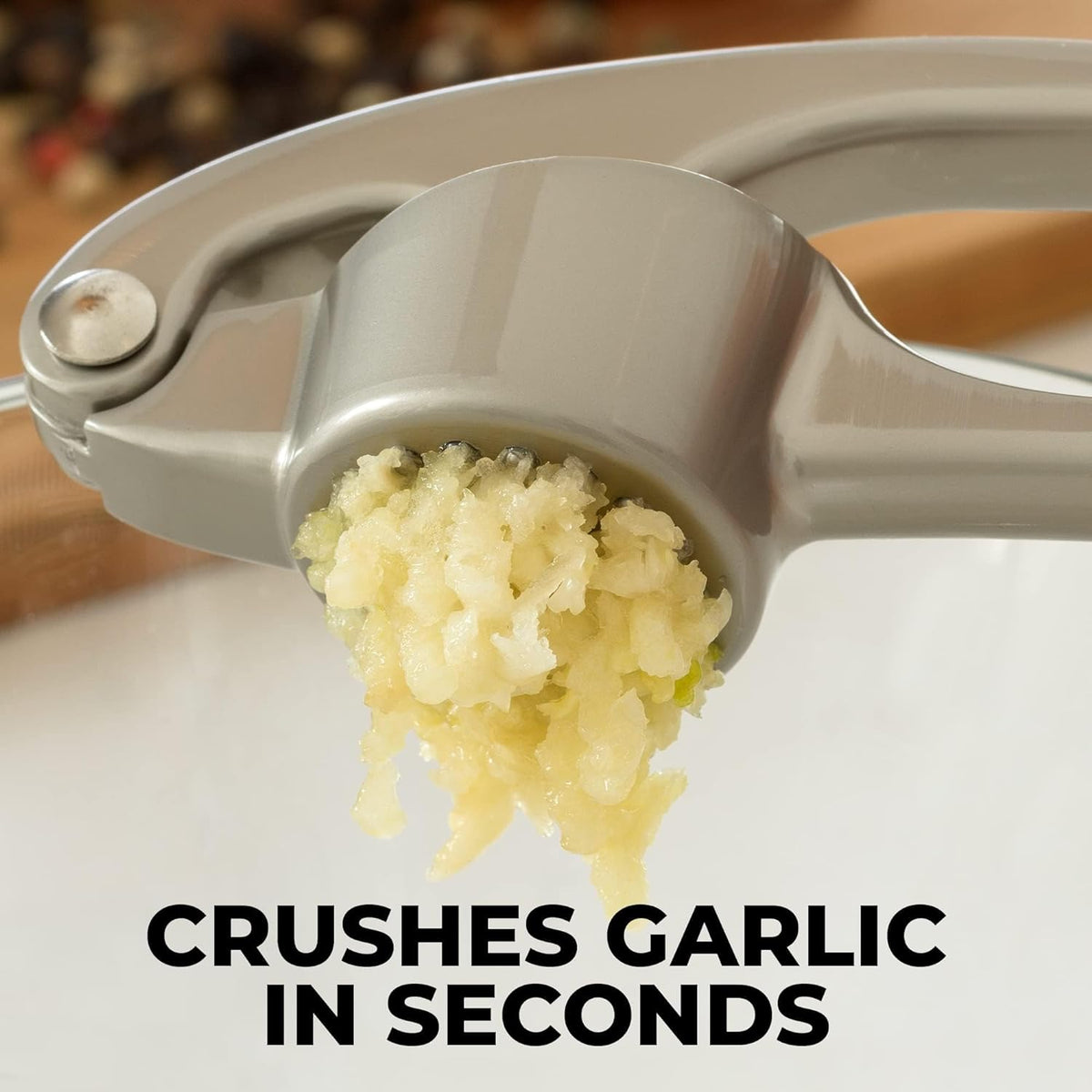 Belro Premium Garlic Press Mincer with stainless steel handles and chamber, designed for easy garlic crushing and mincing in the kitchen.