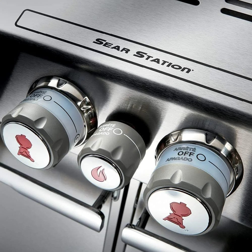 Casavibeo Weber Summit S-470 gas grill with stainless steel lid, multiple burners, side shelves, and built-in thermometer.