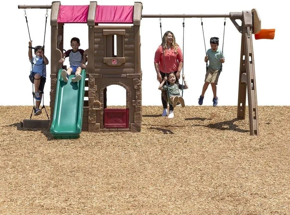 Casavibeo Step2 Naturally Playful Adventure Lodge Play Center with slides, climbing walls, and outdoor play features for kids.
