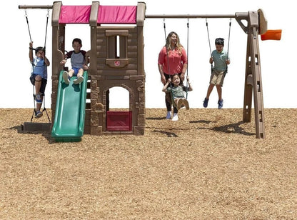Casavibeo Step2 Naturally Playful Adventure Lodge Play Center with slides, climbing walls, and outdoor play features for kids.