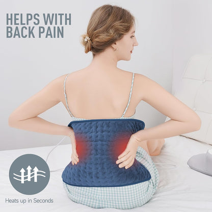Belro electric heating pad for back pain relief, soft fabric cover, plugged in, and heating up for soothing comfort.